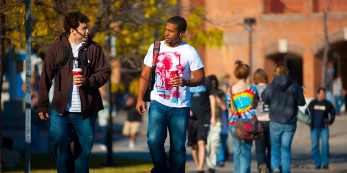 Students walking and talking on UB North Campus. 
