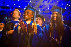 UB graduates clapping. 