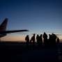 silhouette of people and plane. 