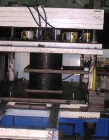 Zoom image: Figure 2.8: Testing of a pair of elastomeric bearings in the large bearing testing machine (click to enlarge) 