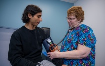 A nurse practitioner taking the blood pressure of a student at the new Student Health Services facility. 