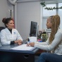 Student in discussion with a u b healthcare provider. 