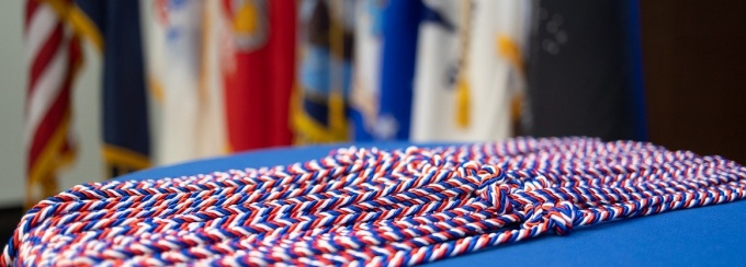 red, white and blue commencement cords at the Veterans ceremony. 