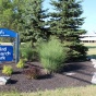 Baird Research Park sign with building in the background. 