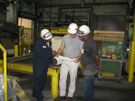 PeroxyChem workers review plans for their facility layout. 