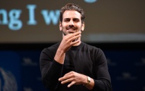 Zoom image: Nyle DiMarco addresses the crowd using American Sign Language in the Center for the Arts on Oct. 23, 2019. 