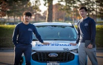 Woman looks for information on a laptop computer.
