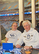 UB fans Brian Little (left) and Philip Cummings relax at the Alumni Association&rsquo;s pre-game party in the Rogers Centre.