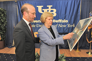 David Panasci and his mother, Faye Panasci, review drawings of the atrium of John Kapoor Hall, the new South Campus home of the School of Pharmacy and Pharmaceutical Sciences. The atrium will be named the Panasci Atrium in recognition of the family&rsquo;s $1 million gift. Photo: NANCY J. PARISI