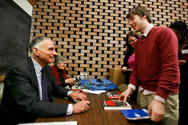 Ralph Nader signs books for those attending his lecture in the UB Law School.