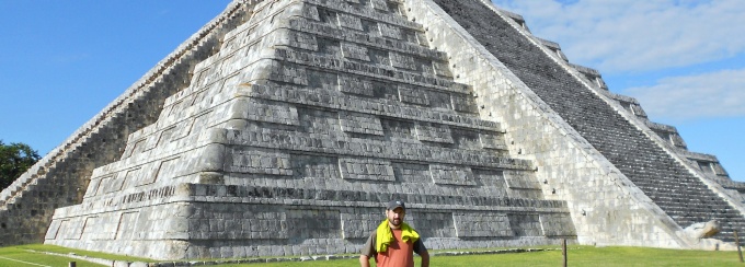 Photo of graduate student with Maya pyramid. 