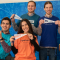 Six UB students holding Career Community pennants. 
