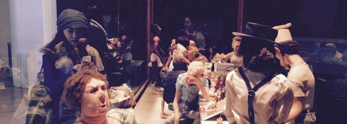 Students view a mise en scene of grotesque dolls on the 2015 Rust Belt Tour. 