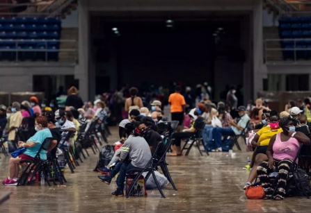 People waiting to be evacuated in Lake Charles, Louisiana on August 25. ANDREW CABALLERO-REYNOLDS/AFP via Getty Images. 