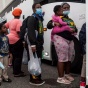 People waiting to board a bus to evacuate Lake Charles, Louisiana, where Hurricane Laura was expected to hit. ANDREW CABALLERO-REYNOLDS/AFP via Getty Images. 