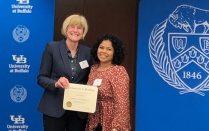 Zoom image: Pictured at the 2022 awards ceremony, UB College of Arts and Sciences Dean Robin G. Schulze (left) and Linda Alegria (right) UB Mathematics Graduate Student. 