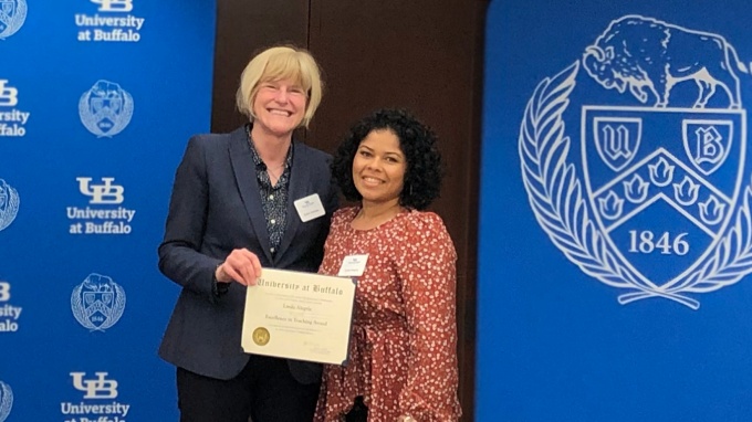 Zoom image: Pictured at the 2022 awards ceremony, UB College of Arts and Sciences Dean Robin G. Schulze (left) and Linda Alegria (right) UB Mathematics Graduate Student. 