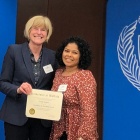 Zoom image: Pictured at the 2022 awards ceremony, UB College of Arts and Sciences Dean Robin G. Schulze (left) and Linda Alegria (right) UB Mathematics Graduate Student. 