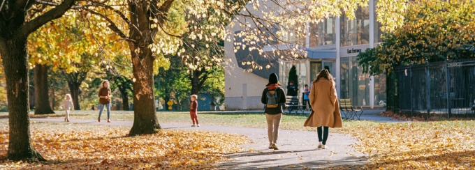 fall season with students walking on campus. 