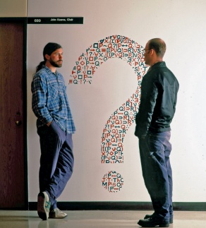 Students confer outside the department chair's office, circa 1997. 