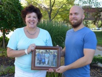 Zoom image: Elizabeth Felmet (left) receives with a retirement gift from John C. Beverley (right) on behalf of UB Philosophy graduate students. 