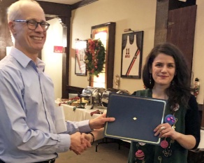 Zoom image: Dr. David Braun (left) presents the 2018 Peter Hare Award for Best Overall Paper to Ariane Nomikos for her essay, “Place Matters.” 