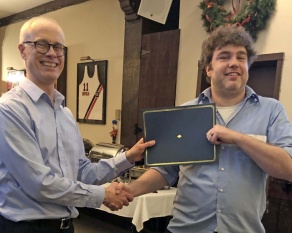 Zoom image: Dr. David Braun (left) presents the 2018 Thomas D. Perry Award for Best Dissertation Defense to Clint Dowland. 