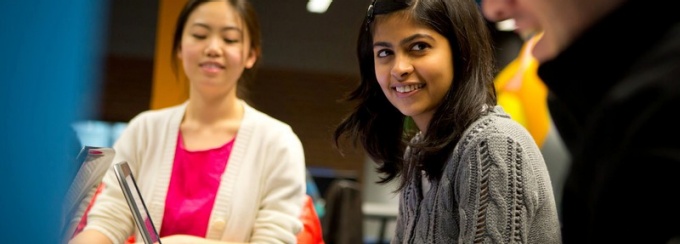 Students collaborating together on UB campus. 