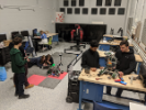 The team works on their robots and engineering notebook in the SMART Automation Sandbox. Shown are: Sean Courtney, Kody Weber, Kelly Mackey, Greg Anto, Brigid Hickey, Anish Avasthi and Conor Coster.