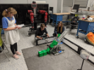 Brigid Hickey, Greg Anto and Kelly Mackey work on the autonomous period code for the 24in cubed robot.
