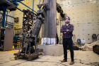 PhD candidate Emre Kizilarslan in Ketter Hall’s Structural Engineering and Earthquake Simulation Laboratory with part of his Composite Plate Shear Wall-Concrete Filled specimen. Under the direction of his advisor, SUNY Distinguished Professor Michel Bruneau, Kizilarslan’s testing program is investigating the lateral load behavior of these new walls, typically used in core-wall structures. 