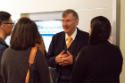 Mark Karwan talking with guests at the reception.