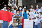 Medical professionals in the march seek to safeguard the lives and well-being of their patients through the elimination of racism.
