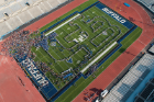 Incoming students take their spots in the formation of the human interlocking UB, a Welcome Weekend tradition since 2004. Photo by Mark Adams