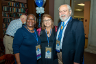 Linda Grace-Kobas and George Kobas smile with Advancement staff member Wendy Irving.