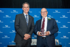 Kenneth Dow, BS ‘80 (right), recipient of the 2022 Distinguished Alumni Award for the School of Pharmacy and Pharmaceutical Sciences poses with Dean Gary Pollack. 