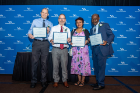 From left to right: Timothy Maynes, Charles Lindsey, Sanjukta Das Smith and Alex Ampadu, members of the School of Management Faculty Philanthropy Committee, received the 2022 Philip B. Wels Outstanding Service Award. 
