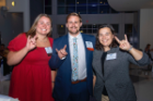 Guests of the Fast 46 event show their UB pride with a Horns Up!