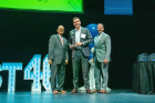 Martin Vidal, BA ’03, leads company Trusted Nurse Staffing. They were back on the list again for 2022, coming in at number 13. Here, Martin accepts his award with President Satish K. Tripathi (left) and Bank on Buffalo President Michael Noah (right). 