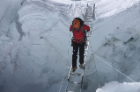 Traversing the Khumbu Icefall via ice ladder. Photo: Dave Hahn