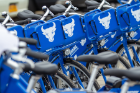 UB Bikeshare program bicycles emblazoned with the spirit mark and signature blue and white colors. 