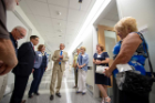 Attendees on a tour of the Jacobs School of Medicine and Biomedical Sciences building. 