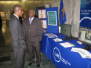 Individuals chatting in front of the SUNY booth at the 2011 Albany Caucus
