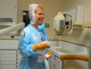 Dental assisting student cleaning lab classroom