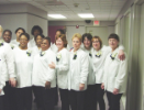 Newly-pinned dental assisting students pose for a group photo