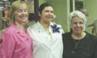 Two faculty members pose with a newly-pinned dental assisting student 