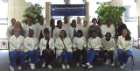 Newly-pinned dental assisting students and faculty pose for a group photo