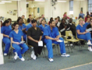 Dental assisting school students in audience during dental pinning ceremony