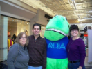 Three individuals pose with the ADA mascot