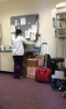 Dental Assisting school student standing at a lab counter 